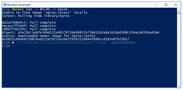 PowerShell running DockerCli.exe -SwitchDaemon — command-line equivalent of the tray-icon switch between engines