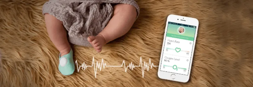 Owlet Baby Care smart sock — slides over baby's foot to alert parents to breathing changes and heart-rate concerns via iPhone