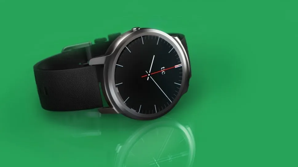 Black-and-grey TicWatch smartwatch on a green background — Frog Design wearable from the 2016 predictions list